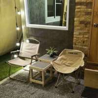 มุมนั่งเล่นหน้าบ้านจิ๋วกลางสวนที่สวนปันสุขสุโขทัย